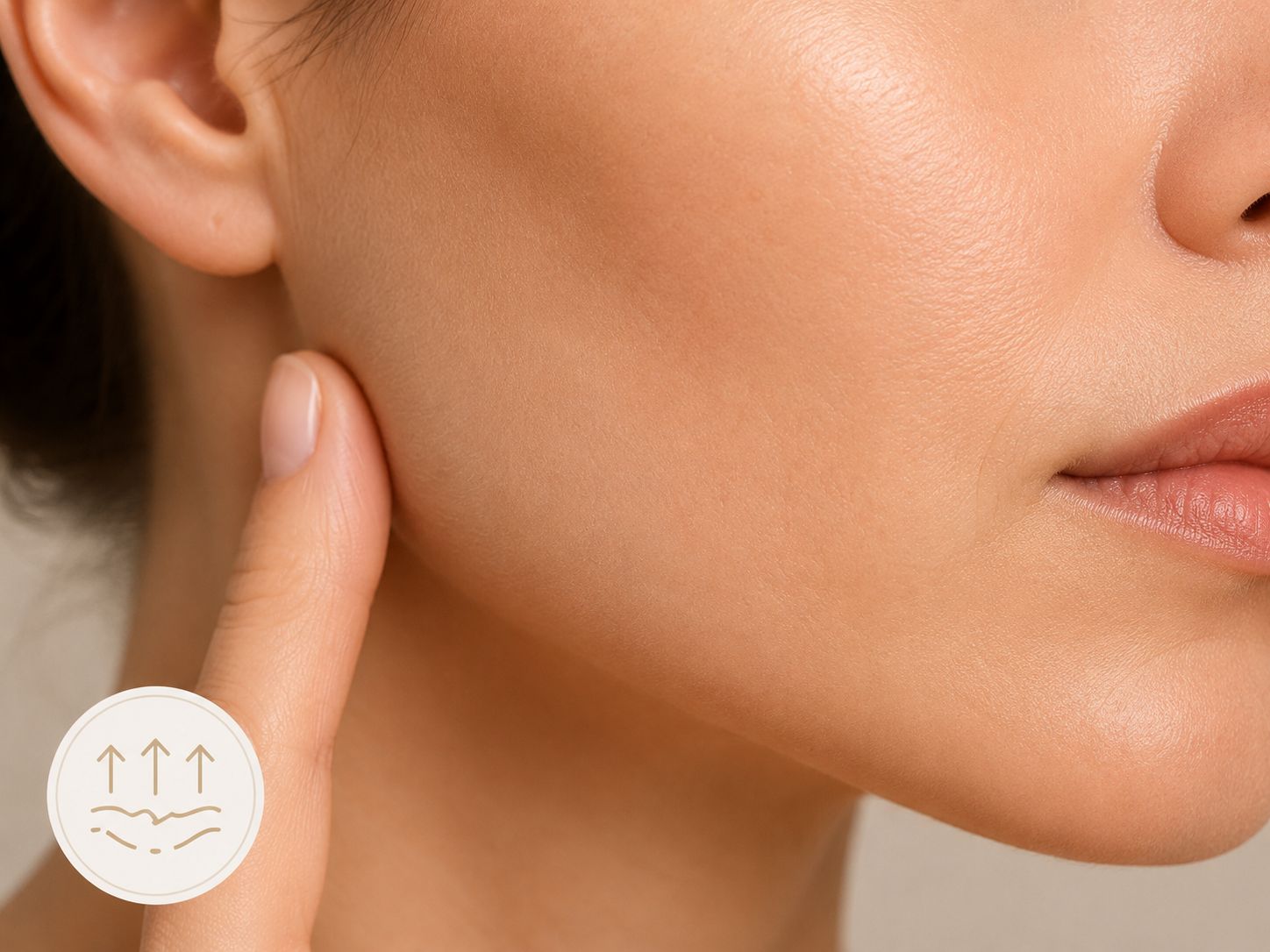 Jawline close-up with a finger pressing the skin